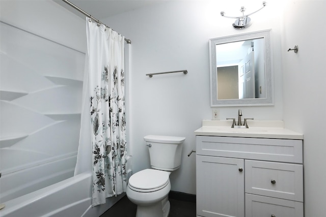 bathroom featuring baseboards, toilet, shower / bath combo, and vanity