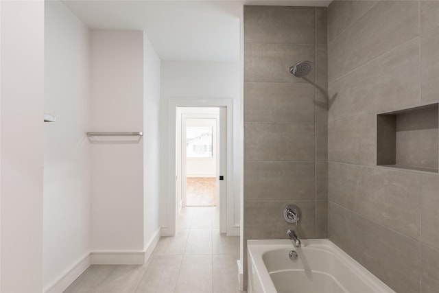 full bathroom featuring tile patterned floors,  shower combination, and baseboards