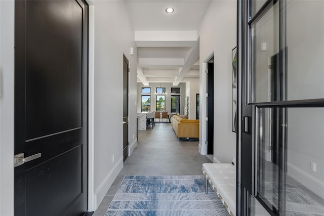 hallway featuring beam ceiling, recessed lighting, baseboards, and coffered ceiling