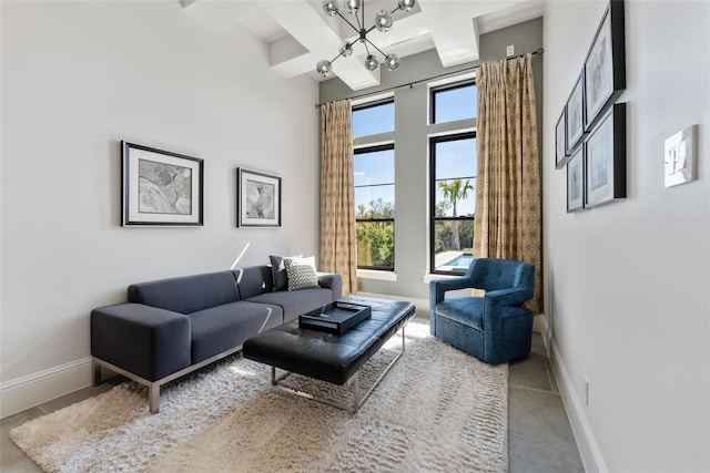 299 Peninsula Point Dr, Montgomery, TX 77356 - tiled living area featuring baseboards, a chandelier, beam ceiling, coffered ceiling, and a towering ceiling
