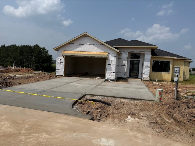 299 Peninsula Point Dr, Montgomery, TX 77356 - property in mid-construction with an attached garage, concrete driveway, and a shingled roof