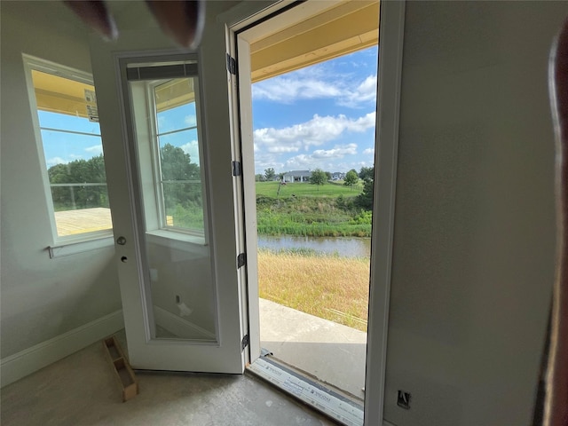 299 Peninsula Point Dr, Montgomery, TX 77356 - entryway featuring a water view and baseboards