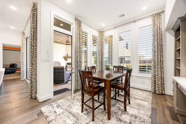 dining room featuring visible vents, recessed lighting, and wood finished floors