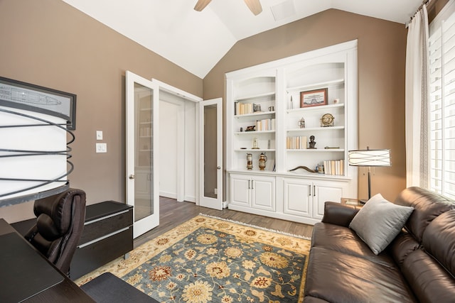 home office with wood finished floors, visible vents, lofted ceiling, ceiling fan, and french doors