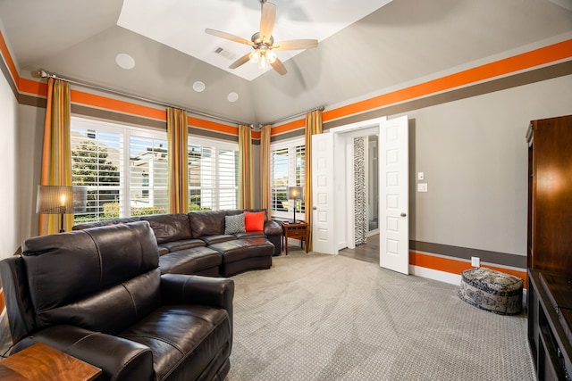 carpeted living area with vaulted ceiling, visible vents, baseboards, and ceiling fan