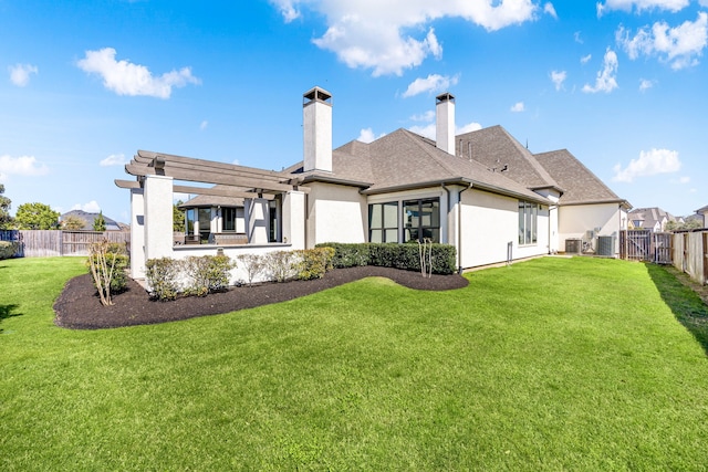 back of property featuring stucco siding, a yard, a fenced backyard, a pergola, and a patio