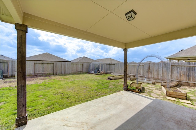 view of patio / terrace with a vegetable garden and a fenced backyard