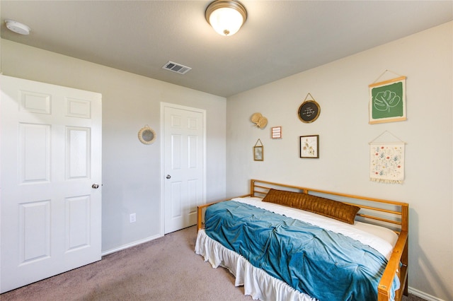 bedroom featuring visible vents, baseboards, and carpet flooring