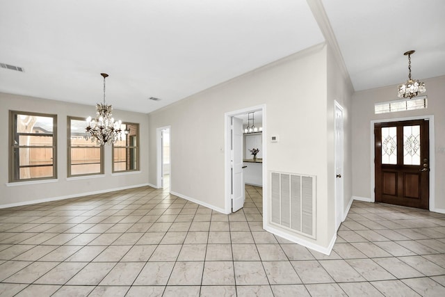 entrance foyer featuring light tile patterned floors, visible vents, baseboards, and an inviting chandelier