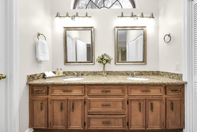 bathroom featuring double vanity and a sink