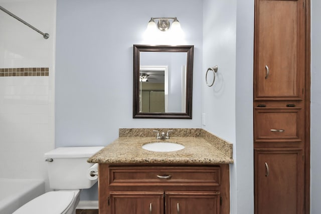 bathroom featuring toilet and vanity