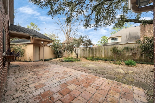 view of patio featuring fence