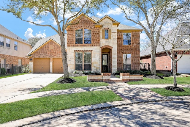 view of front facade featuring a garage, stone siding, brick siding, and driveway