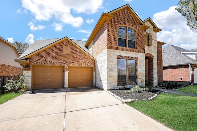 traditional home with a shingled roof, concrete driveway, a garage, stone siding, and brick siding