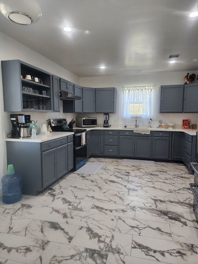 kitchen with under cabinet range hood, light countertops, marble finish floor, stainless steel appliances, and open shelves