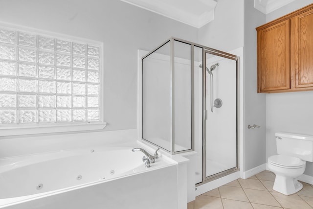 full bathroom featuring toilet, a jetted tub, a stall shower, and tile patterned flooring