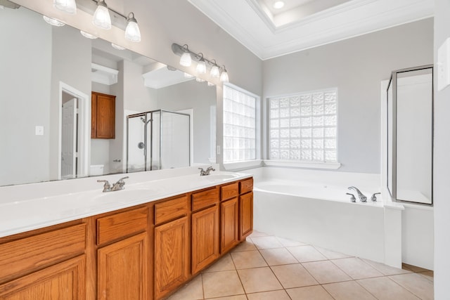 full bath featuring a sink, a shower stall, crown molding, tile patterned floors, and a bath