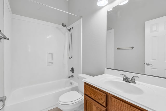 bathroom with shower / bath combination, toilet, and vanity