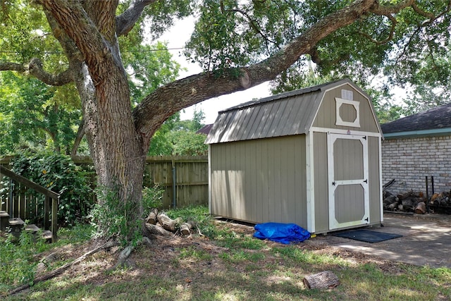 view of shed with fence