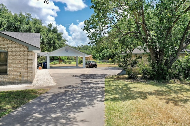 view of road featuring concrete driveway