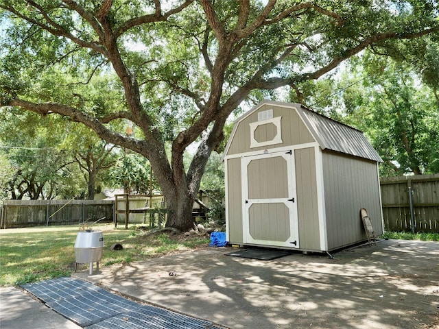 view of shed featuring a fenced backyard