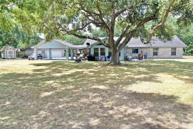 single story home with a front yard, an outdoor structure, brick siding, and a shed