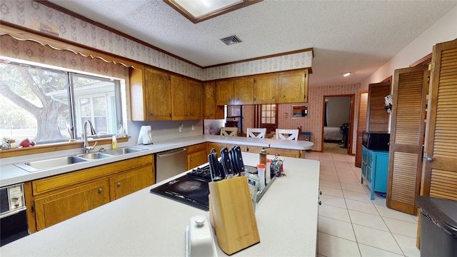 kitchen featuring brown cabinets, a sink, a textured ceiling, wallpapered walls, and dishwasher