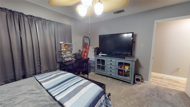 bedroom with visible vents, baseboards, carpet, and a ceiling fan