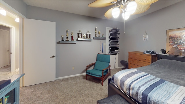 carpeted bedroom with baseboards and ceiling fan