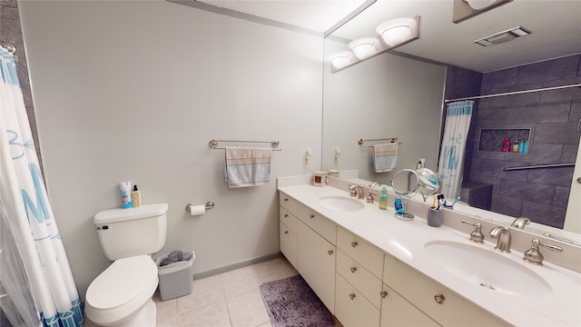 bathroom featuring tile patterned floors, visible vents, toilet, and a sink