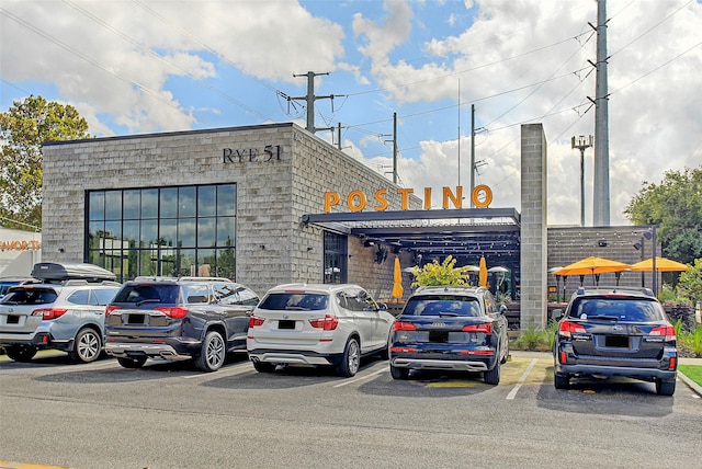 view of property with uncovered parking