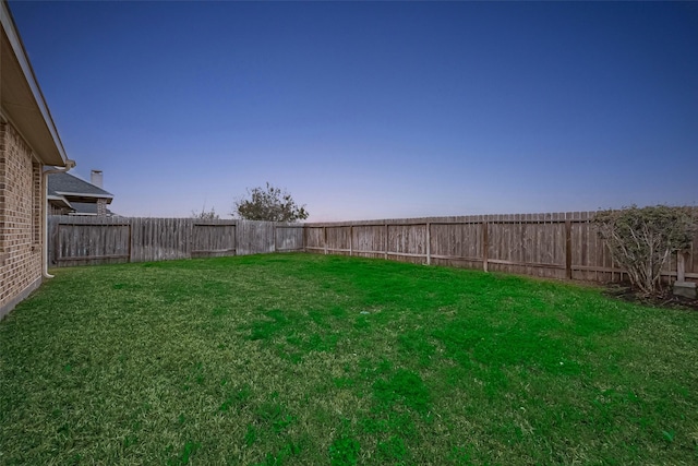 view of yard featuring a fenced backyard