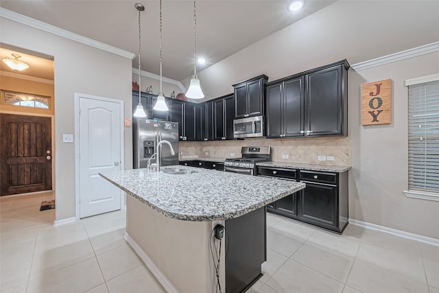 kitchen featuring a sink, ornamental molding, light tile patterned floors, stainless steel appliances, and dark cabinets