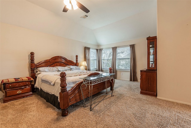 carpeted bedroom featuring a ceiling fan, lofted ceiling, visible vents, and baseboards