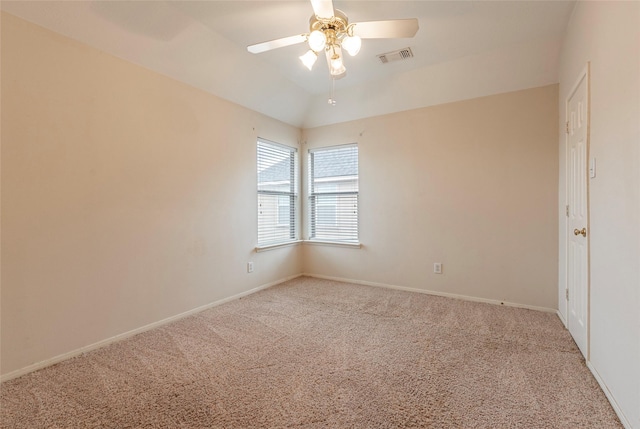 unfurnished room featuring visible vents, baseboards, carpet, lofted ceiling, and a ceiling fan