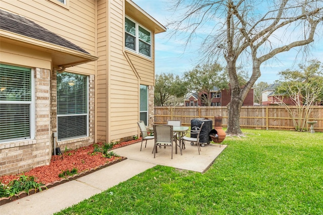 view of yard with a patio and fence