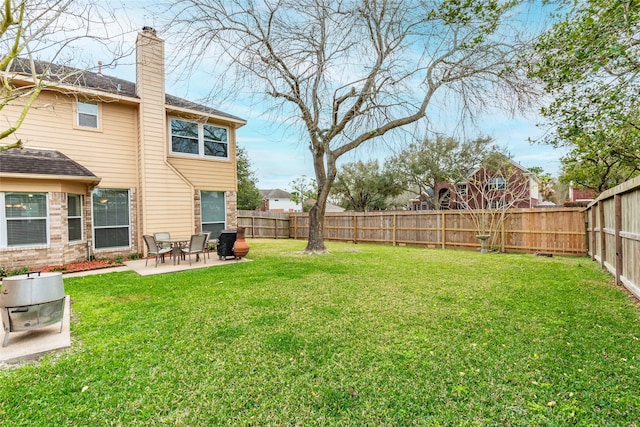 view of yard featuring a patio and a fenced backyard