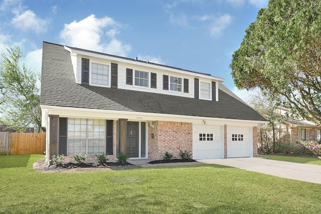 traditional-style home featuring fence, driveway, roof with shingles, a front lawn, and brick siding