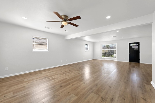 unfurnished living room featuring visible vents, ceiling fan, baseboards, recessed lighting, and wood finished floors