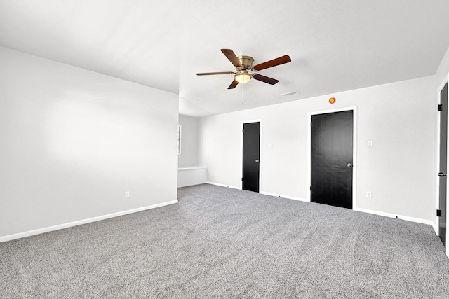 unfurnished bedroom featuring visible vents, carpet floors, baseboards, and a ceiling fan