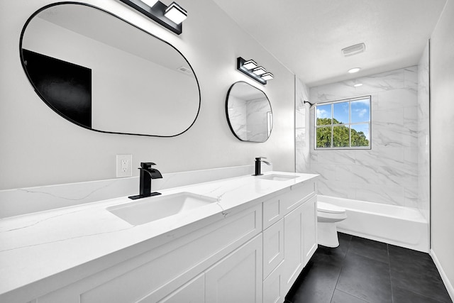 full bathroom with double vanity, toilet, washtub / shower combination, and a sink