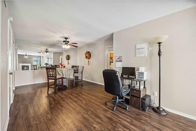 office area featuring baseboards and wood finished floors