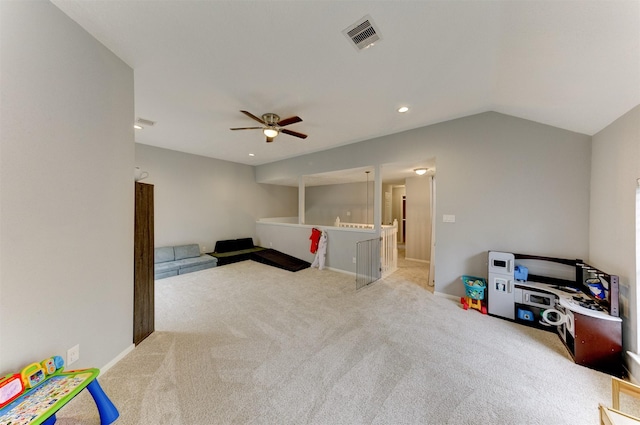 rec room featuring visible vents, lofted ceiling, carpet floors, baseboards, and ceiling fan