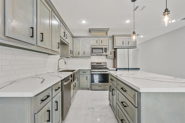 kitchen featuring visible vents, a sink, gray cabinetry, stainless steel appliances, and marble finish floor