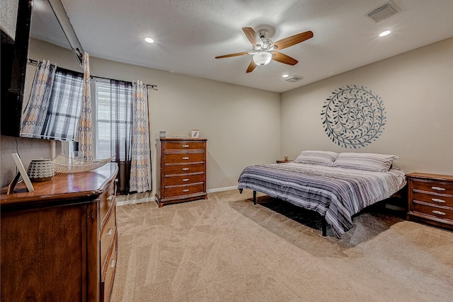 bedroom featuring recessed lighting, visible vents, light carpet, and baseboards