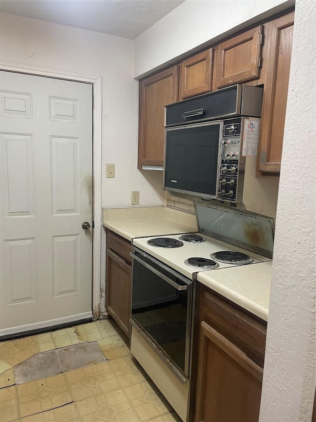 kitchen with light countertops and electric range oven