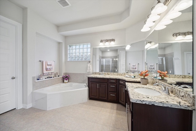 bathroom featuring a sink, visible vents, and a stall shower