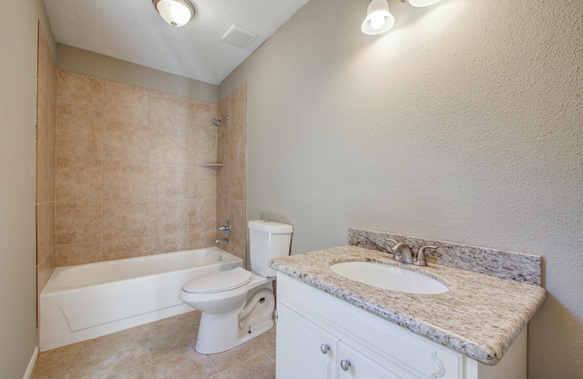 bathroom featuring vanity, a textured ceiling, tile patterned flooring, shower / washtub combination, and toilet