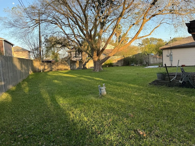 view of yard with a fenced backyard