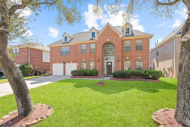 colonial inspired home featuring brick siding, an attached garage, a front yard, central AC unit, and driveway